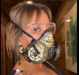 Another woman in painted and bedazzled elastomeric