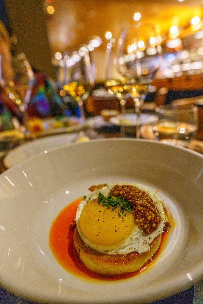 Poached egg, mustard, and pork belly.